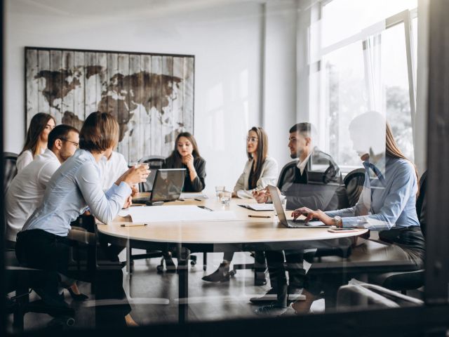 group-people-working-out-business-plan-office